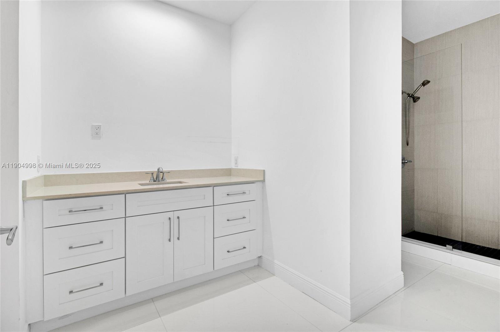 425 Southwest 129th Avenue Miami, FL 33184 - Photo 21 of 24 a bathroom with a sink and vanity