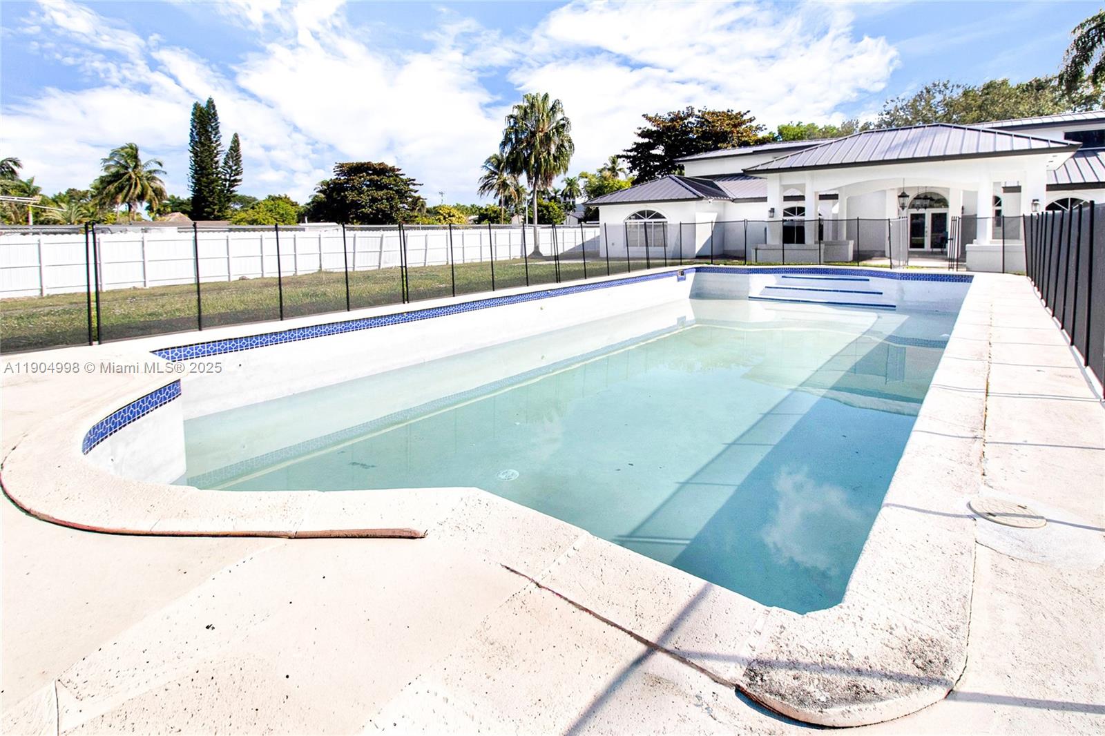 425 Southwest 129th Avenue Miami, FL 33184 - Photo 4 of 24 a view of a house with a swimming pool
