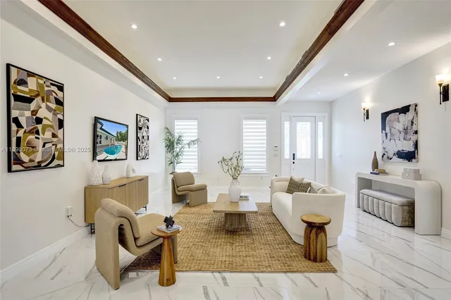 a kitchen with kitchen island a dining table and chairs