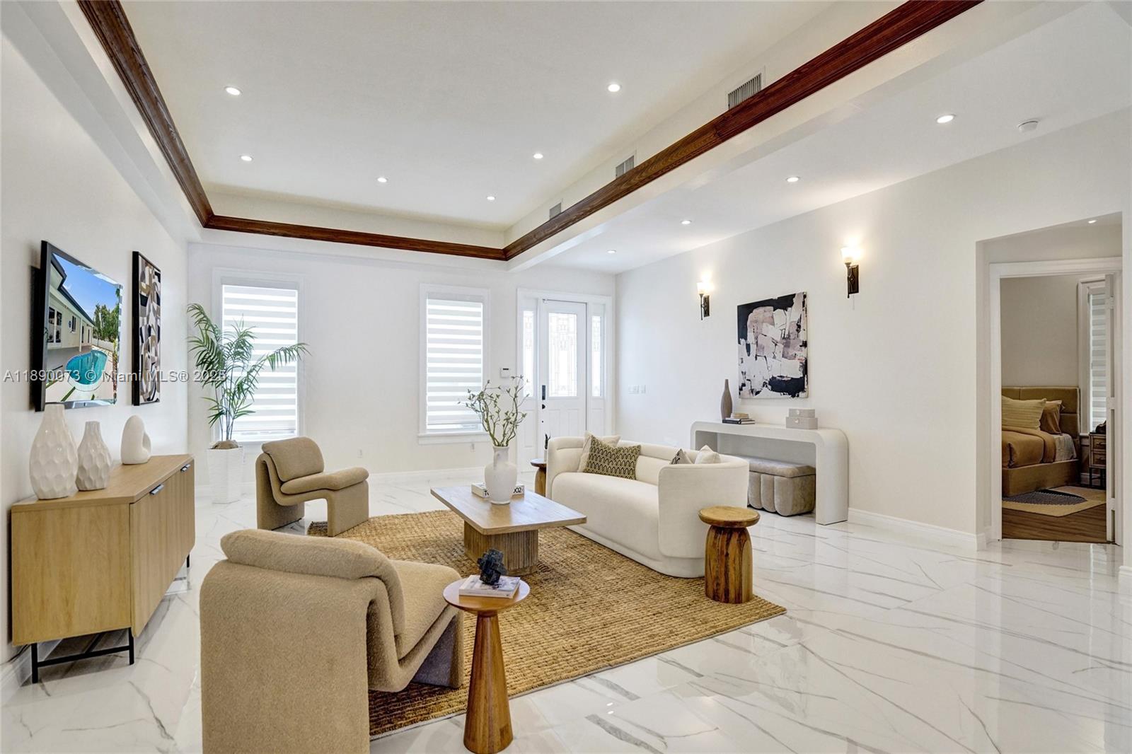 300 North 53 Avenue Hollywood, FL 33021 - Photo 14 of 77 a living room with furniture and a table