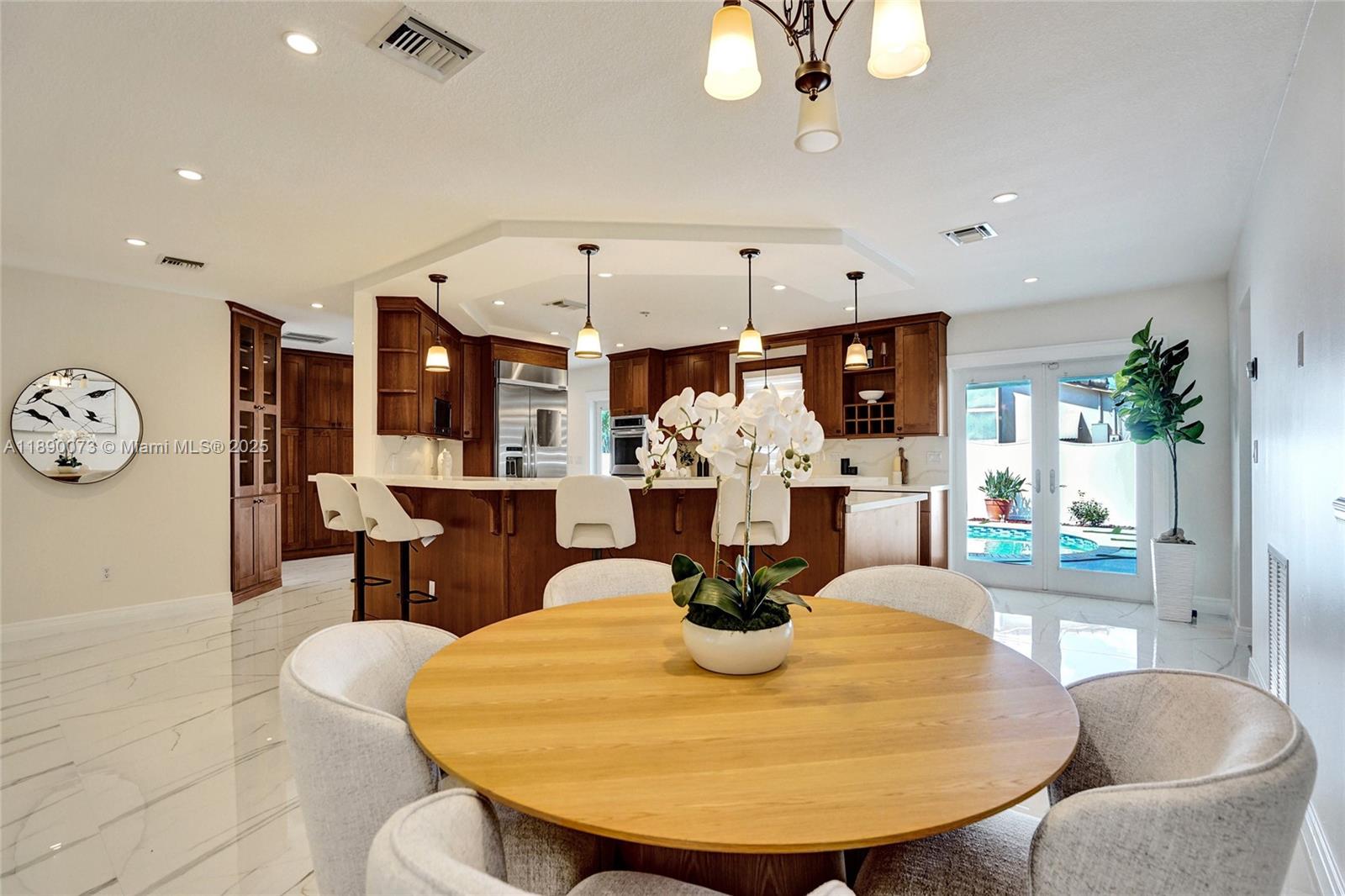 300 North 53 Avenue Hollywood, FL 33021 - Photo 17 of 77 a dining room with wooden floor furniture and kitchen view