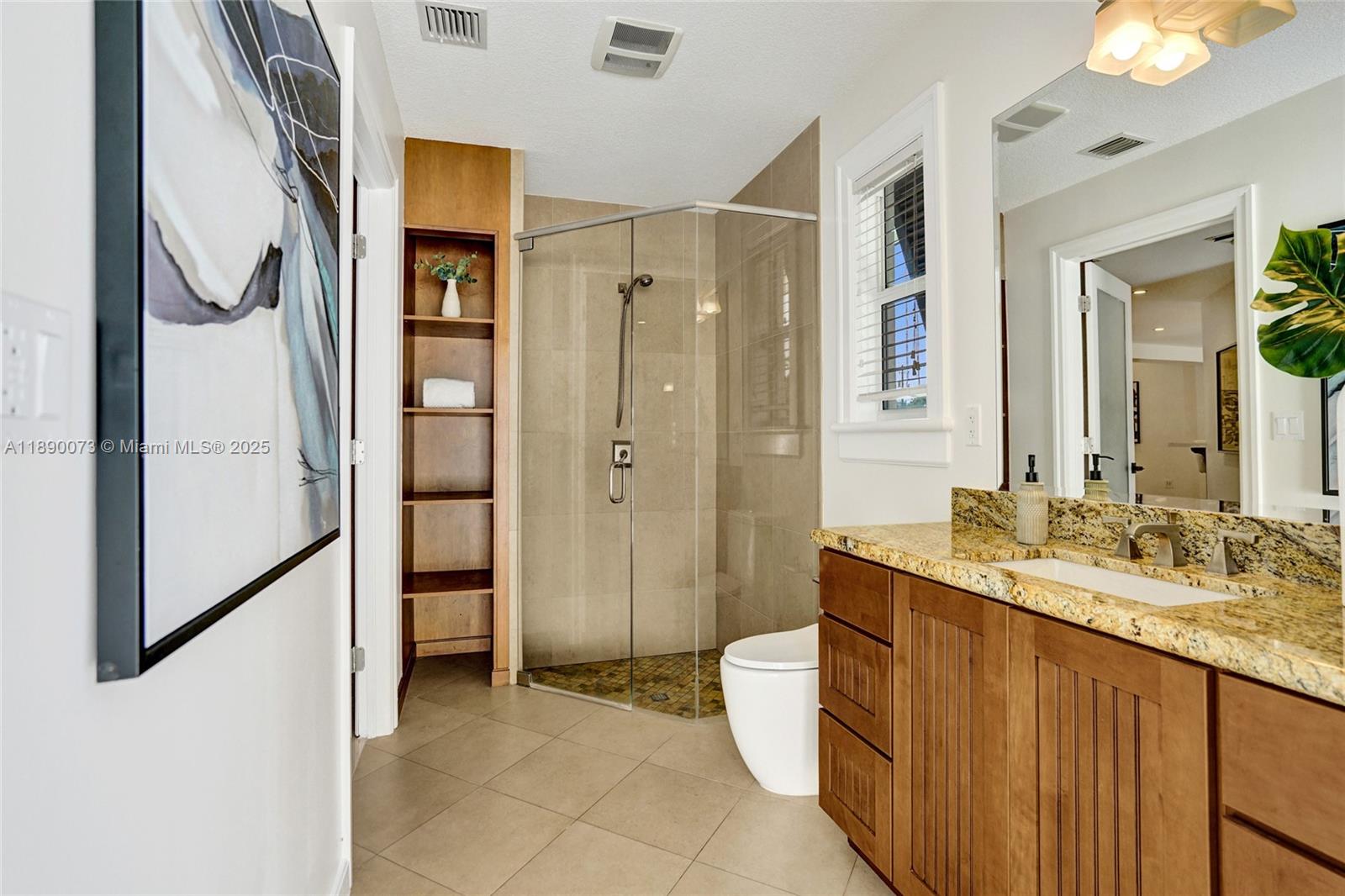 300 North 53 Avenue Hollywood, FL 33021 - Photo 33 of 77 a spacious bathroom with a double vanity sink a mirror and a shower