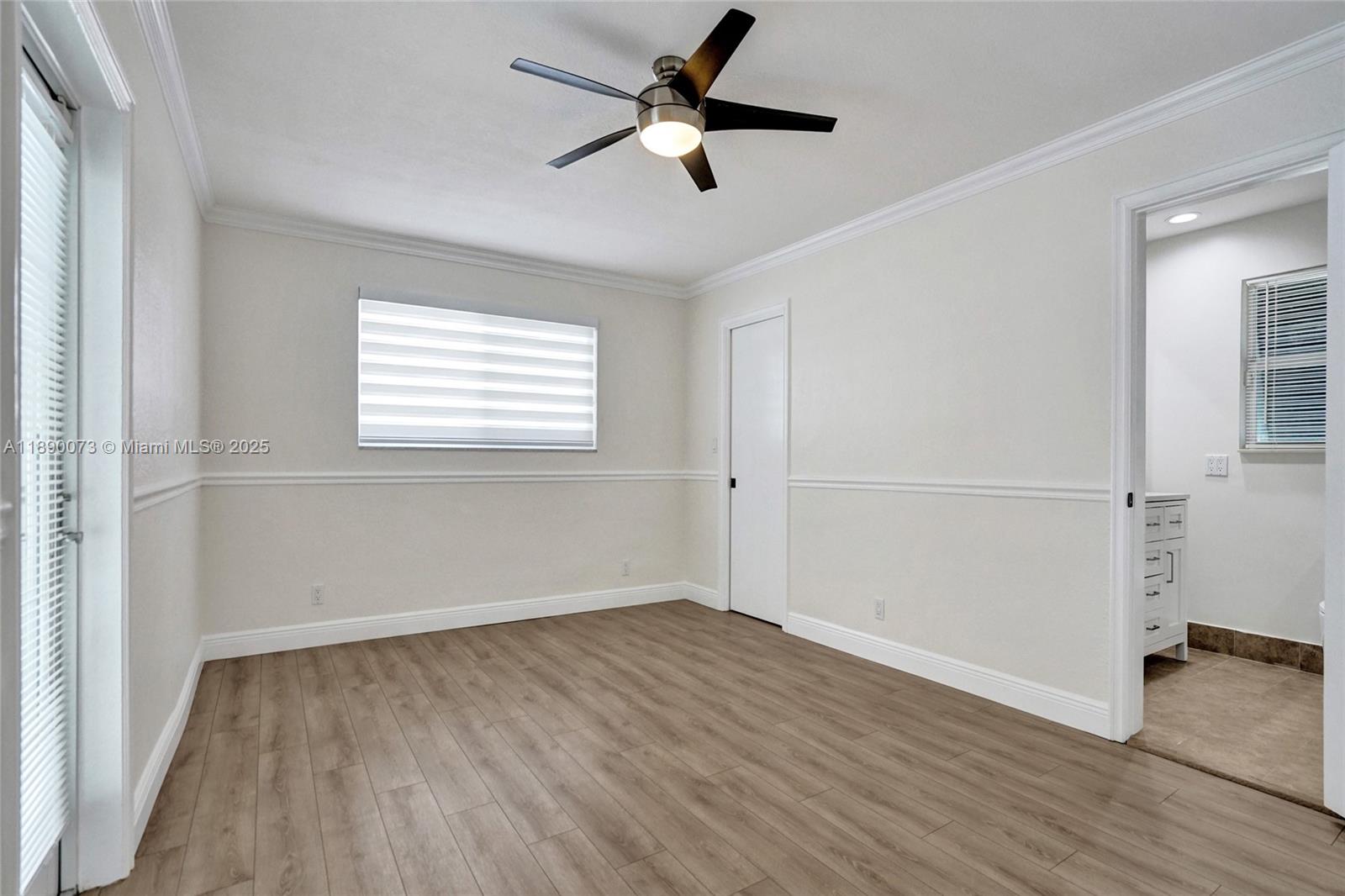 300 North 53 Avenue Hollywood, FL 33021 - Photo 34 of 77 wooden floor in an empty room with a window