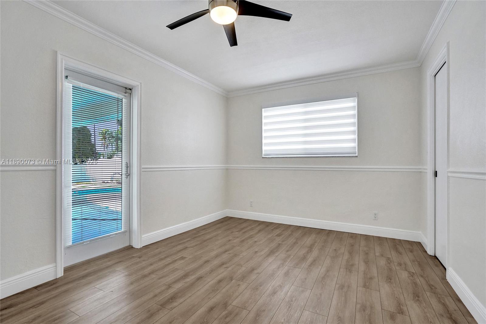 300 North 53 Avenue Hollywood, FL 33021 - Photo 35 of 77 wooden floor in an empty room with a window
