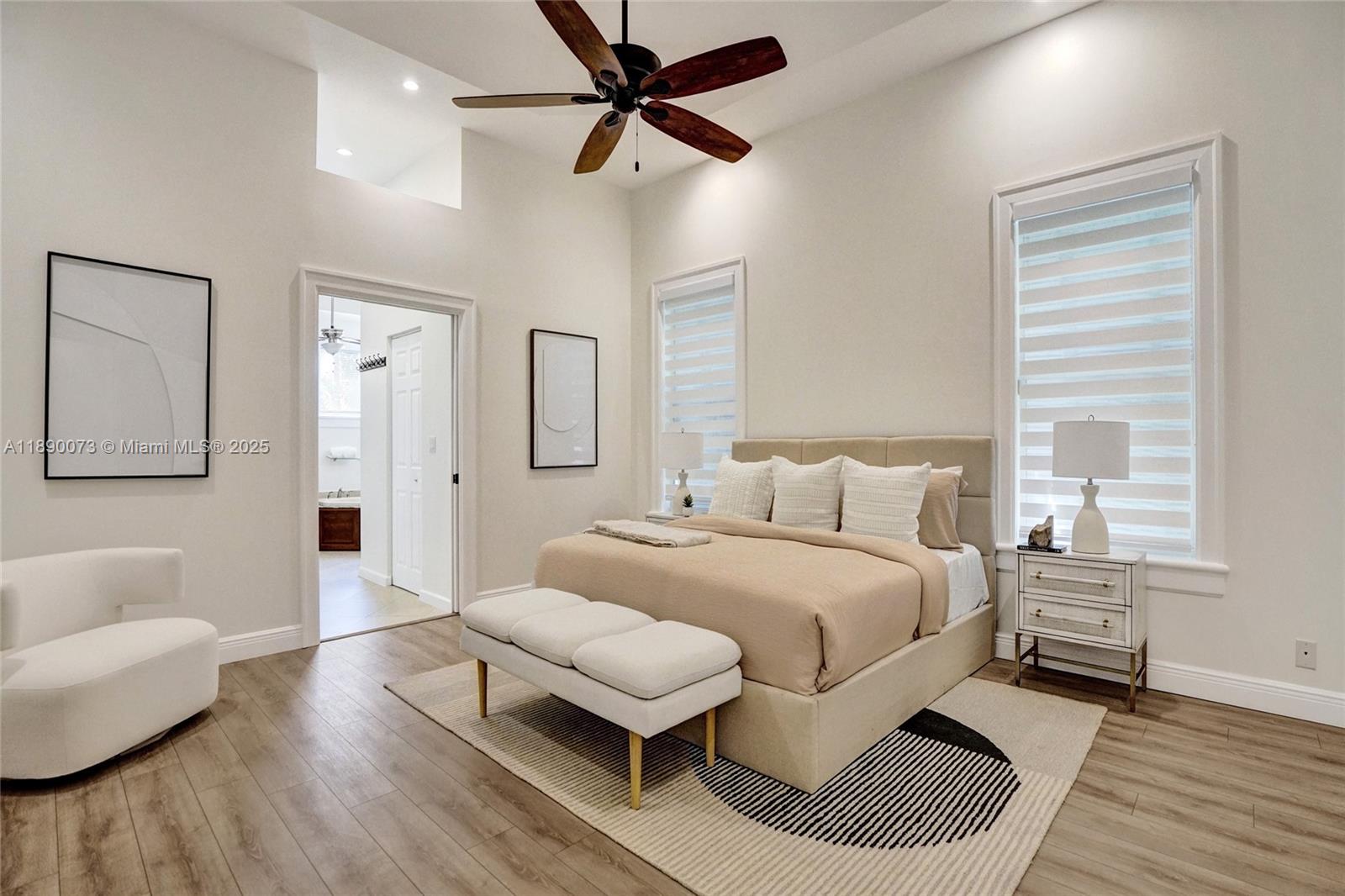 300 North 53 Avenue Hollywood, FL 33021 - Photo 41 of 77 a spacious bedroom with a bed couch and a window