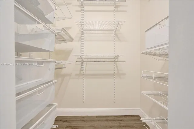 an aerial view of residential houses with outdoor space and river