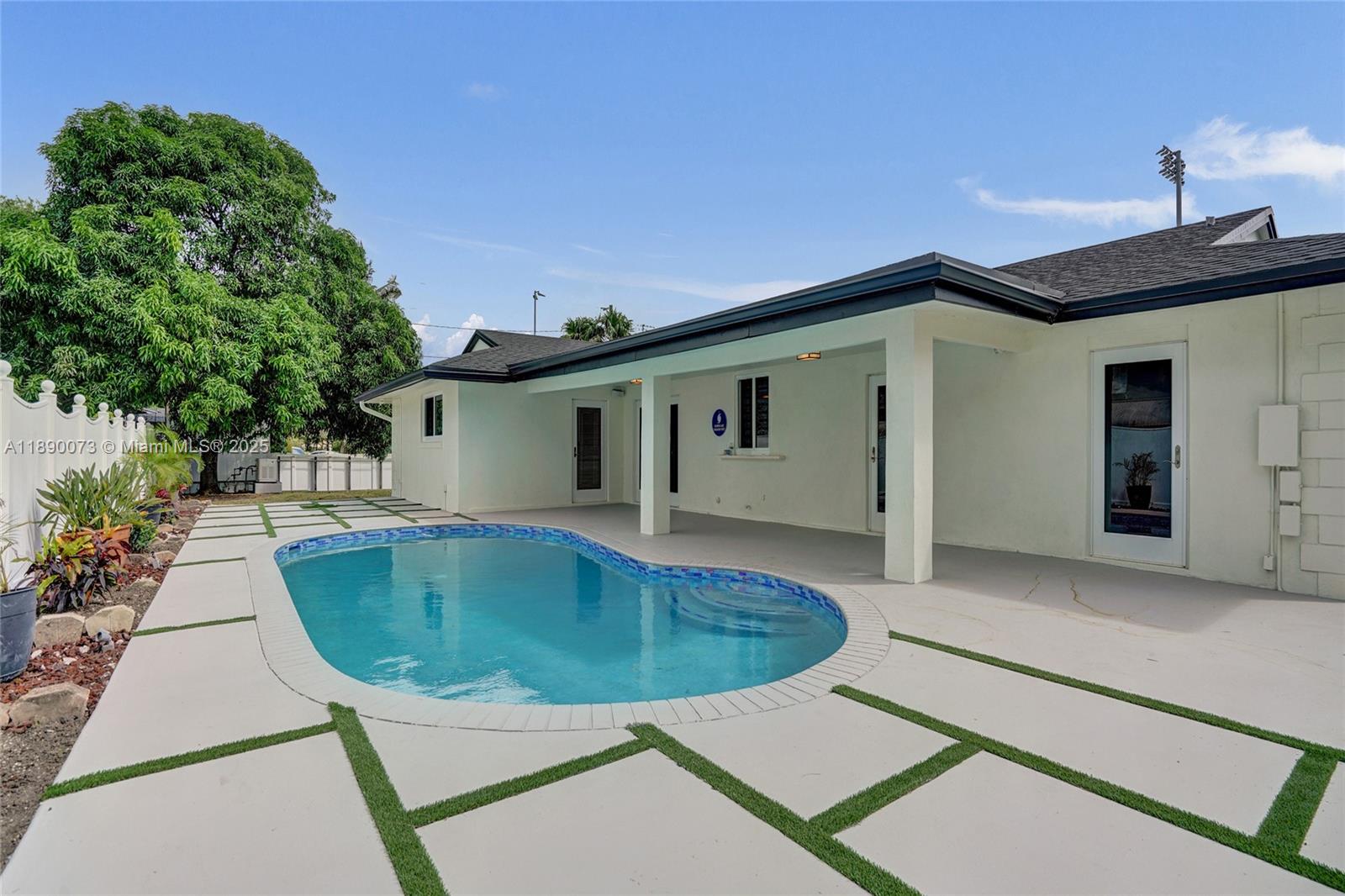 300 North 53 Avenue Hollywood, FL 33021 - Photo 58 of 77 a view of a house with a swimming pool