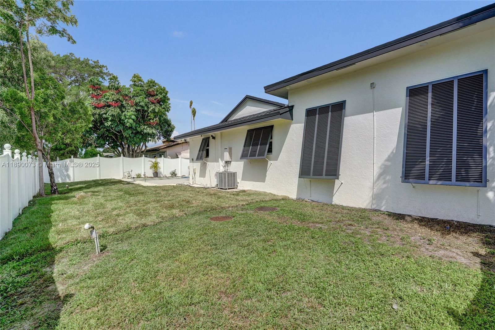 300 North 53 Avenue Hollywood, FL 33021 - Photo 62 of 77 a view of an house with backyard and a tree