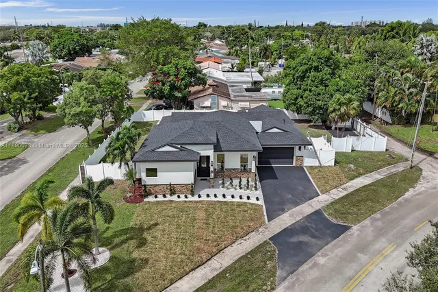 a living room with furniture and view of kitchen
