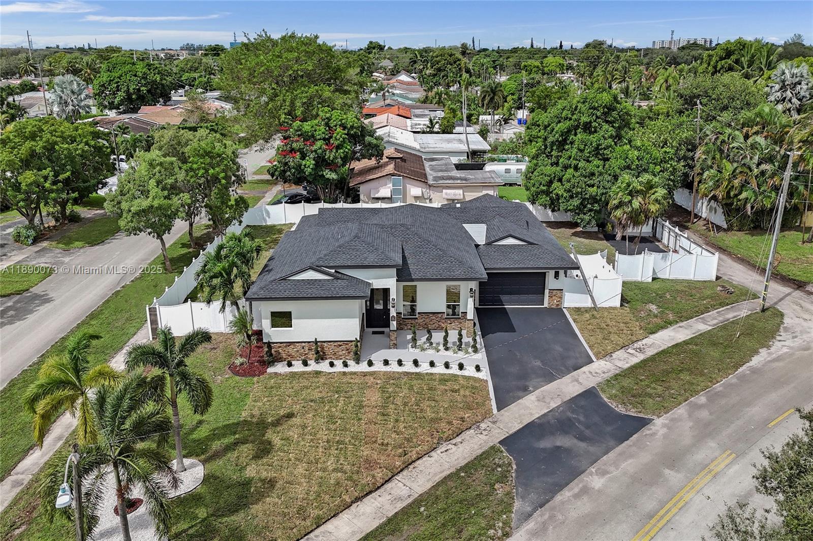300 North 53 Avenue Hollywood, FL 33021 - Photo 7 of 77 a view of a big house with a big yard and large trees