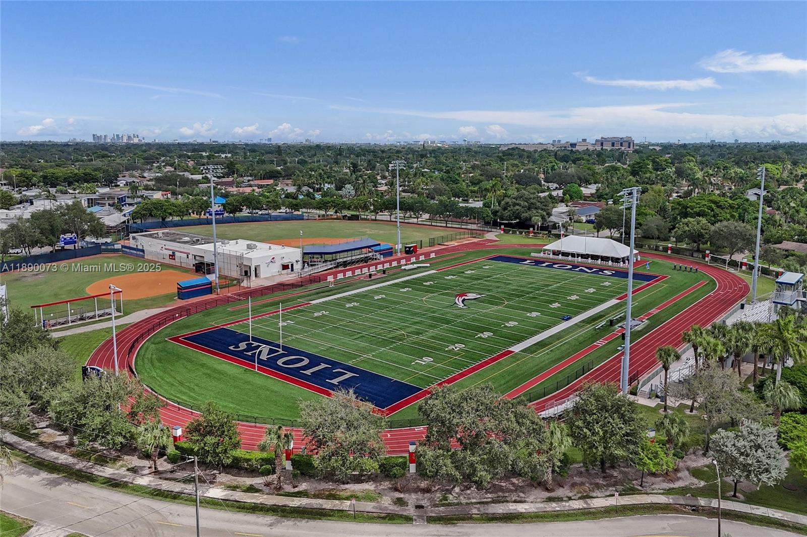 300 North 53 Avenue Hollywood, FL 33021 - Photo 71 of 77 a view of a tennis ground with a large trees