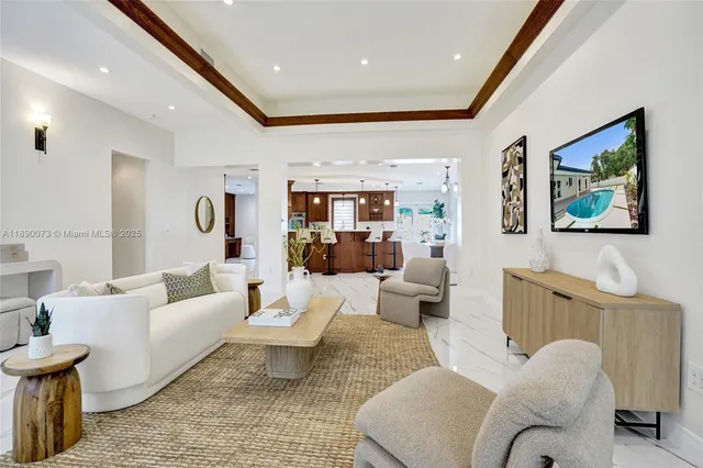 a living room with furniture and a table