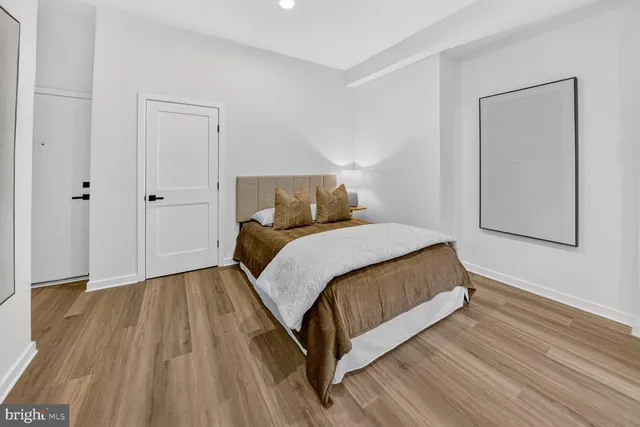 a bedroom with a bed and closet