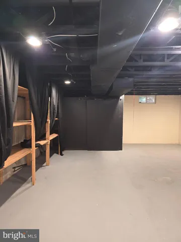 a view of an empty room with stairs