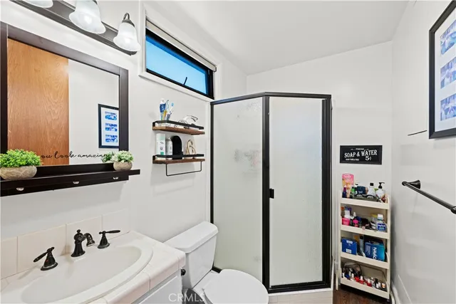 a balcony with furniture and wooden floor