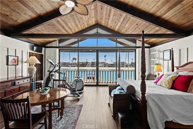 a bedroom with furniture and wooden floors