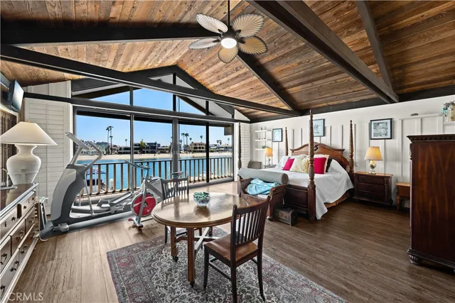 a bedroom with furniture and wooden floor