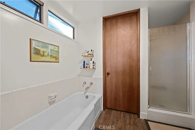 a view of a balcony with chair and wooden floor