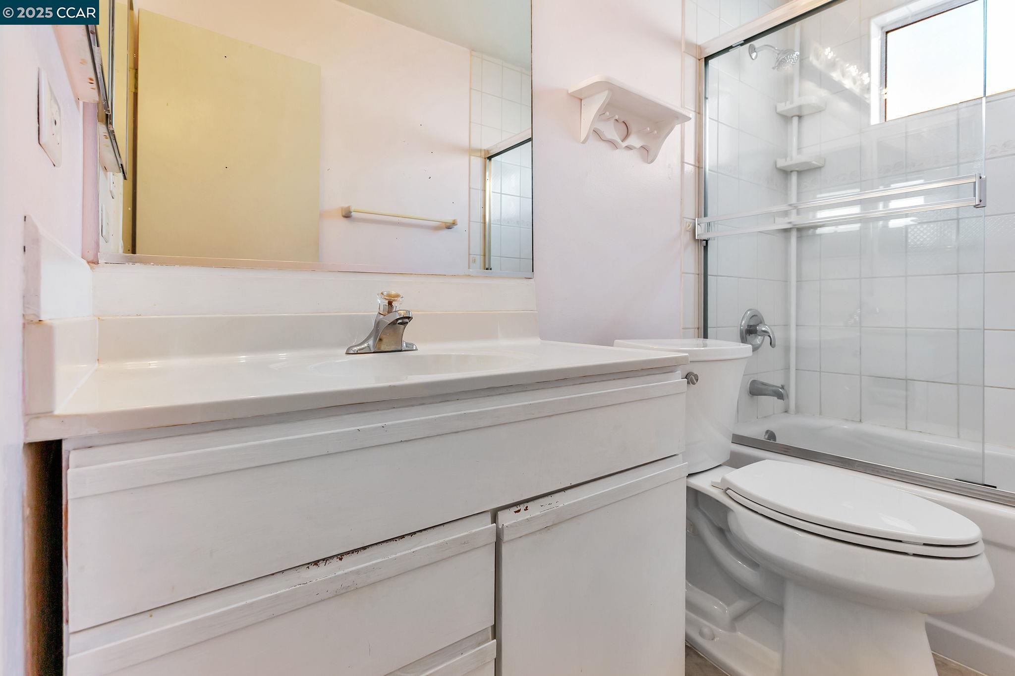 9085 Alcosta Boulevard, Unit 340 San Ramon, CA 94583 - Photo 16 of 25 a bathroom with a sink toilet and shower