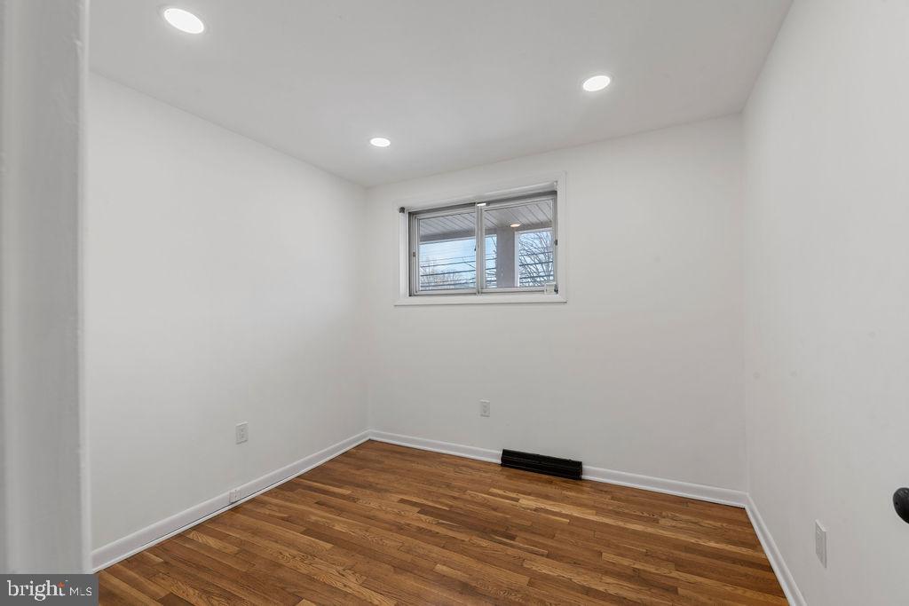 8003 Allentown Road Fort Washington, MD 20744 - Photo 13 of 43 a view of empty room with wooden floor