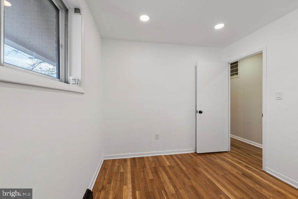 8003 Allentown Road Fort Washington, MD 20744 - Photo 14 of 43 a view of room with window and wooden floor