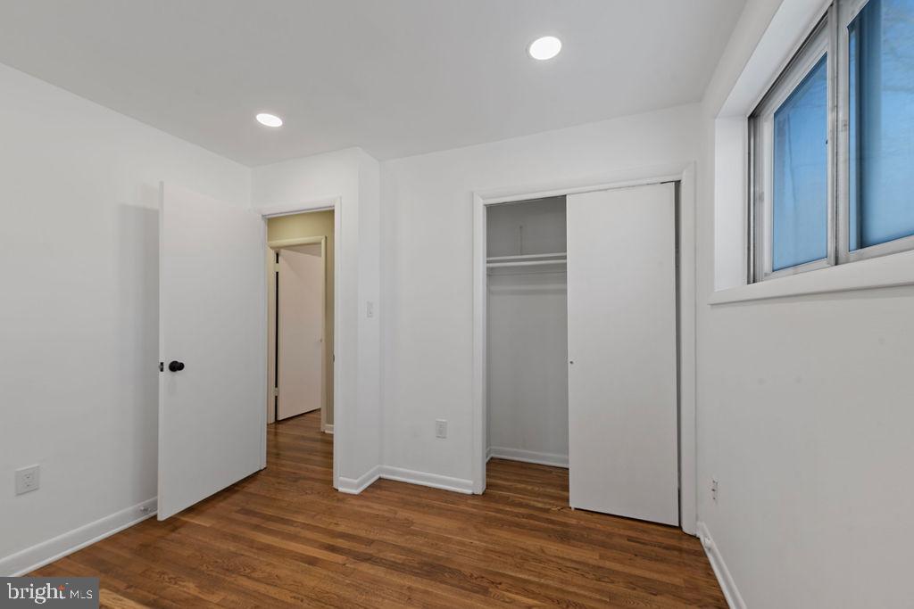 8003 Allentown Road Fort Washington, MD 20744 - Photo 16 of 43 a view of an empty room with wooden floor and closet