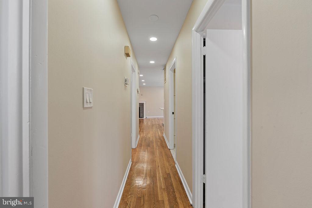 8003 Allentown Road Fort Washington, MD 20744 - Photo 17 of 43 a view of a hallway with wooden floor