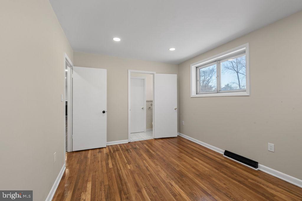 8003 Allentown Road Fort Washington, MD 20744 - Photo 19 of 43 a view of room with wooden floor and window