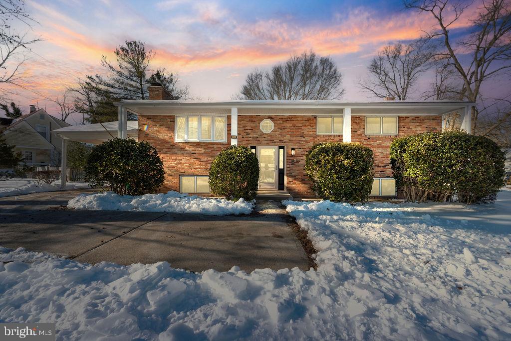 8003 Allentown Road Fort Washington, MD 20744 - Photo 2 of 43 a front view of a house with garden