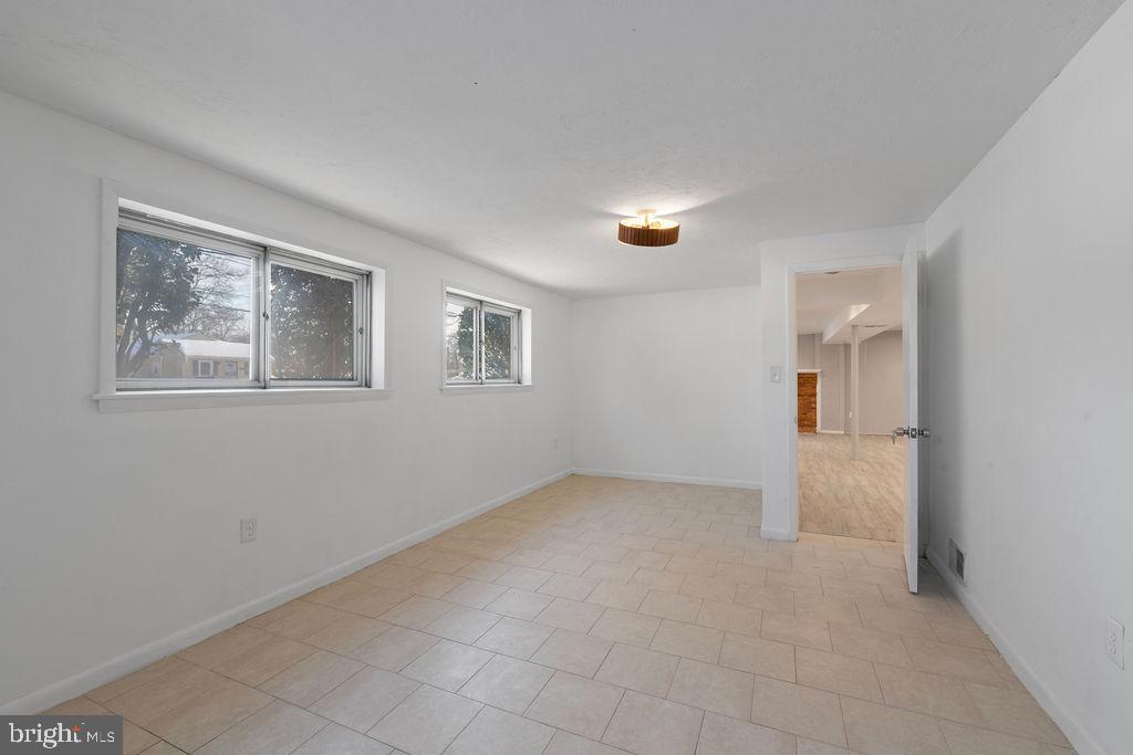 8003 Allentown Road Fort Washington, MD 20744 - Photo 29 of 43 a view of an empty room with a window