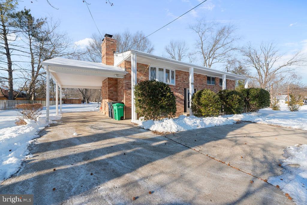 8003 Allentown Road Fort Washington, MD 20744 - Photo 3 of 43 a front view of a house with a yard