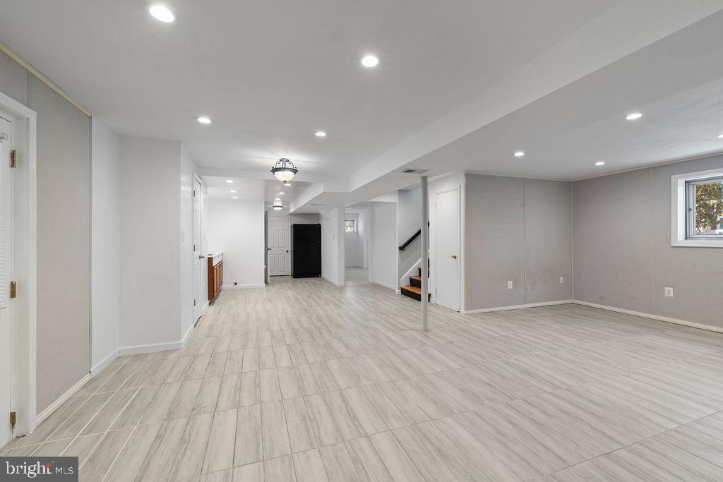 8003 Allentown Road Fort Washington, MD 20744 - Photo 36 of 43 a view of empty room with wooden floor