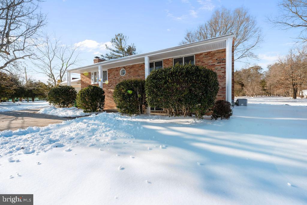 8003 Allentown Road Fort Washington, MD 20744 - Photo 4 of 43 a backyard of a house with a mountain view and a outdoor space