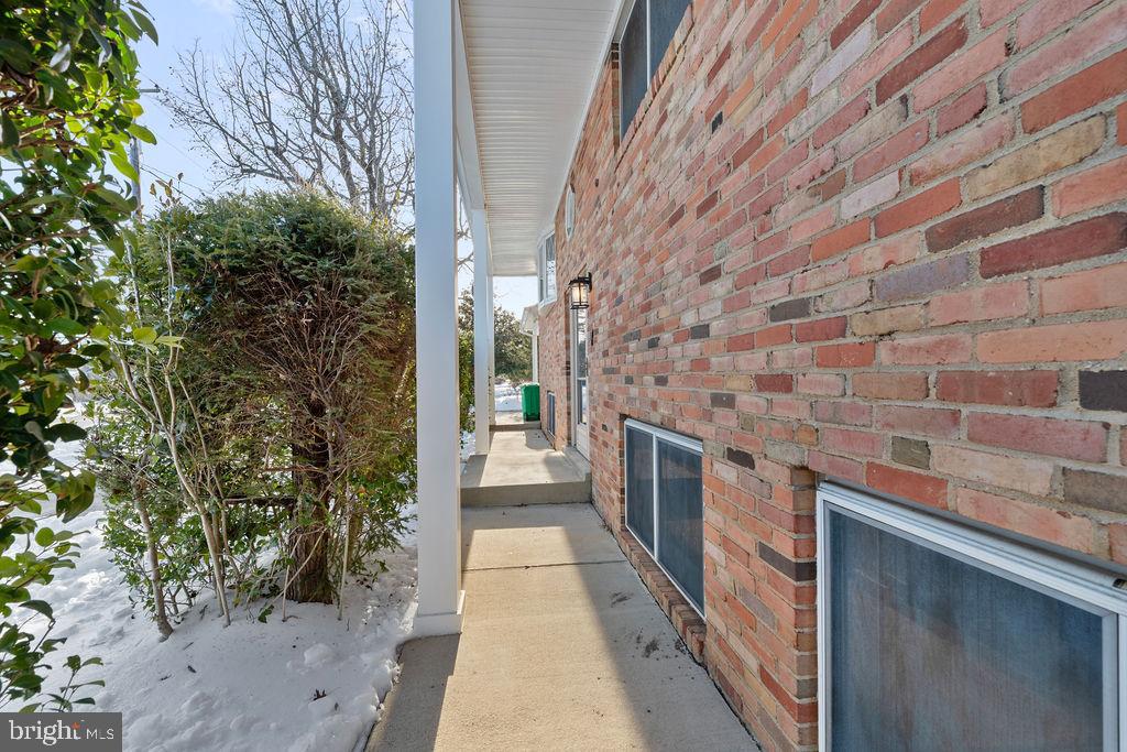 8003 Allentown Road Fort Washington, MD 20744 - Photo 42 of 43 a hallway with a brick wall in front of it
