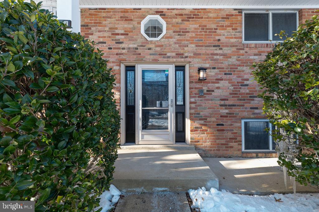 8003 Allentown Road Fort Washington, MD 20744 - Photo 5 of 43 a brick building with a entrance door