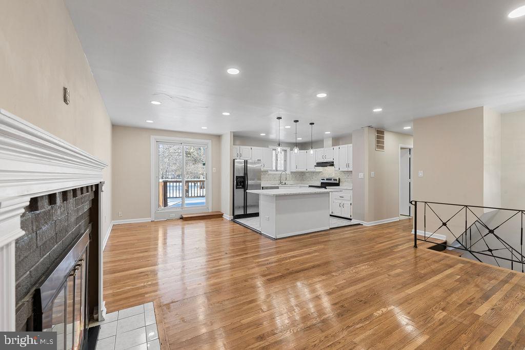 8003 Allentown Road Fort Washington, MD 20744 - Photo 9 of 43 a view of kitchen dining table chairs microwave and cabinets