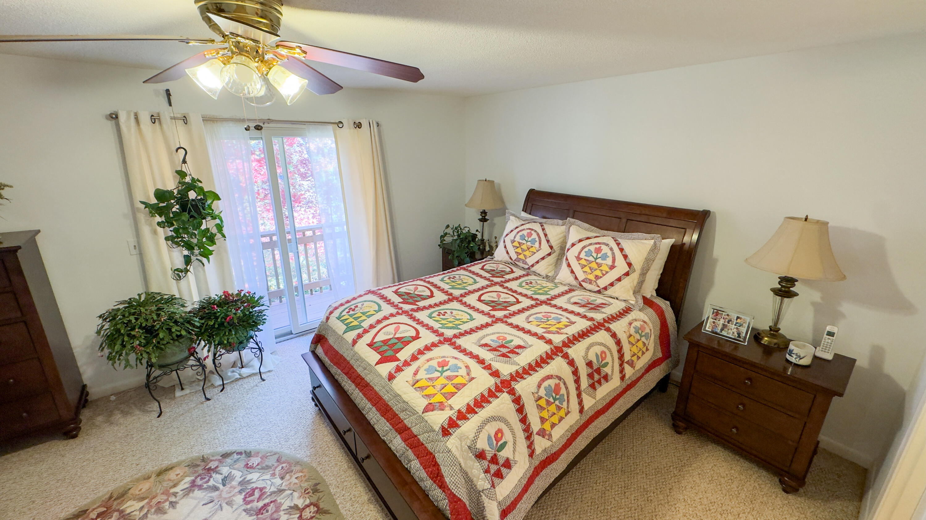300 Buck Island Road, Unit 14F West Yarmouth, MA 02673 - Photo 13 of 27 a bedroom with bed and a chandelier