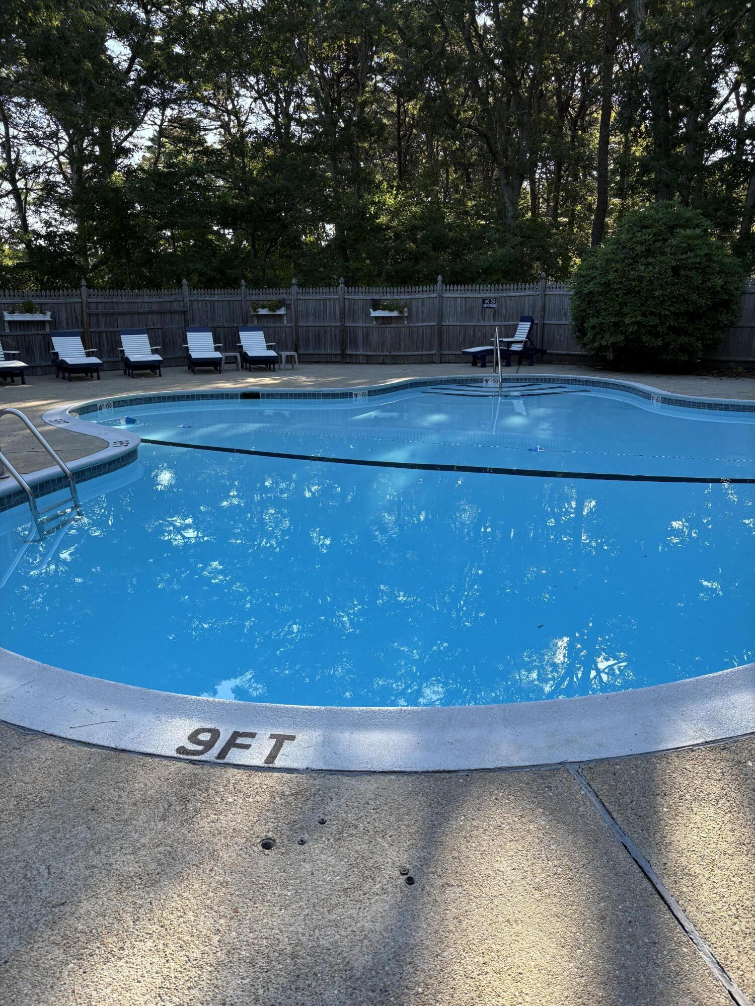 300 Buck Island Road, Unit 14F West Yarmouth, MA 02673 - Photo 22 of 27 a room with a lots of furniture and clutter