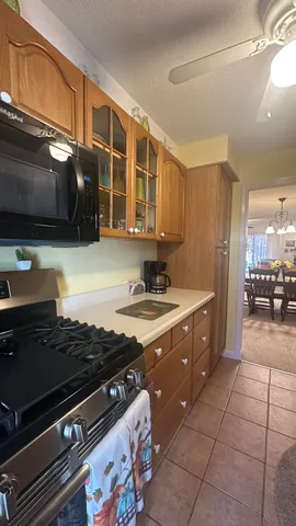a kitchen with a stove a sink and a microwave