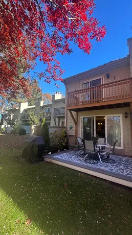 a view of a chairs and table in the patio