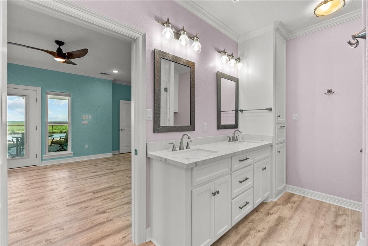 6 Trout Lane Freeport, TX 77541 - Photo 16 of 40 a bathroom with a double vanity sink and a mirror
