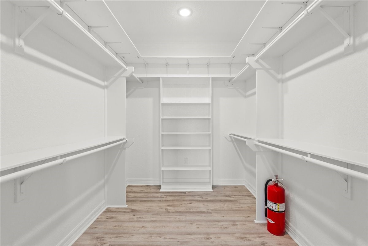 6 Trout Lane Freeport, TX 77541 - Photo 17 of 40 a room with walk in closet and closet