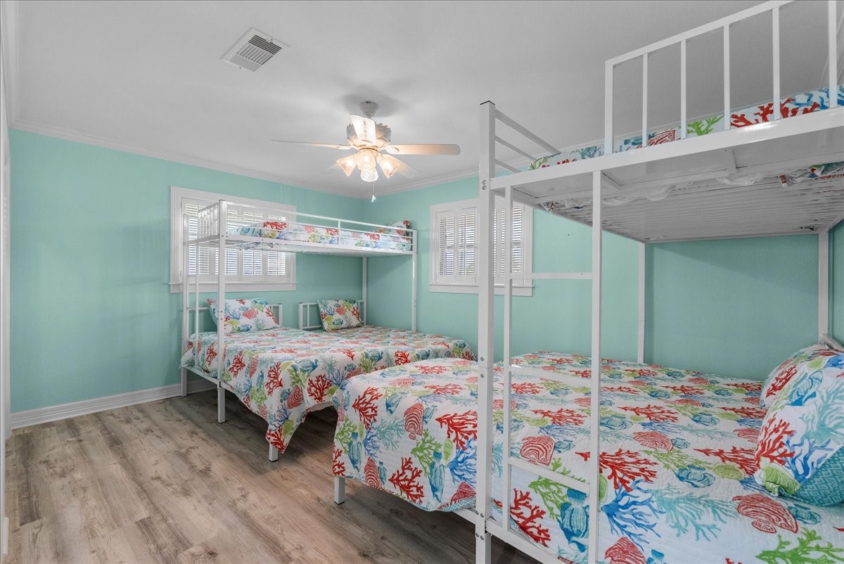 6 Trout Lane Freeport, TX 77541 - Photo 20 of 40 a bedroom with a bed table and window