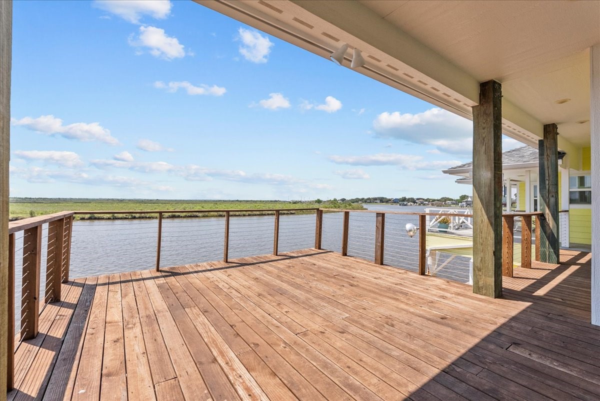 6 Trout Lane Freeport, TX 77541 - Photo 2 of 40 a view of balcony with floor to ceiling windows with wooden floor