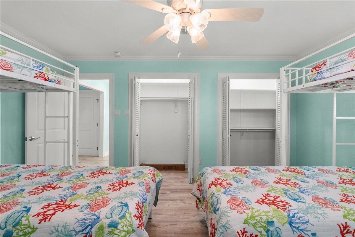 6 Trout Lane Freeport, TX 77541 - Photo 21 of 40 a bedroom with bed and wooden floor