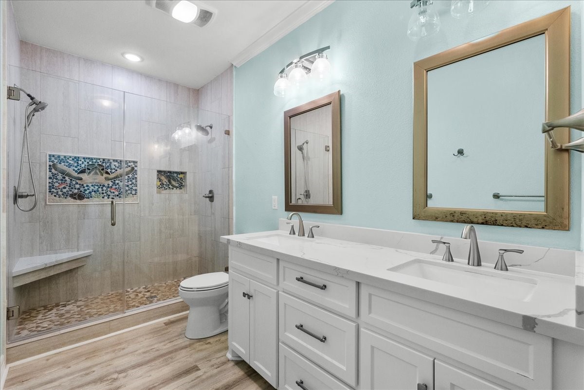 6 Trout Lane Freeport, TX 77541 - Photo 22 of 40 a bathroom with a double vanity sink mirror double and shower