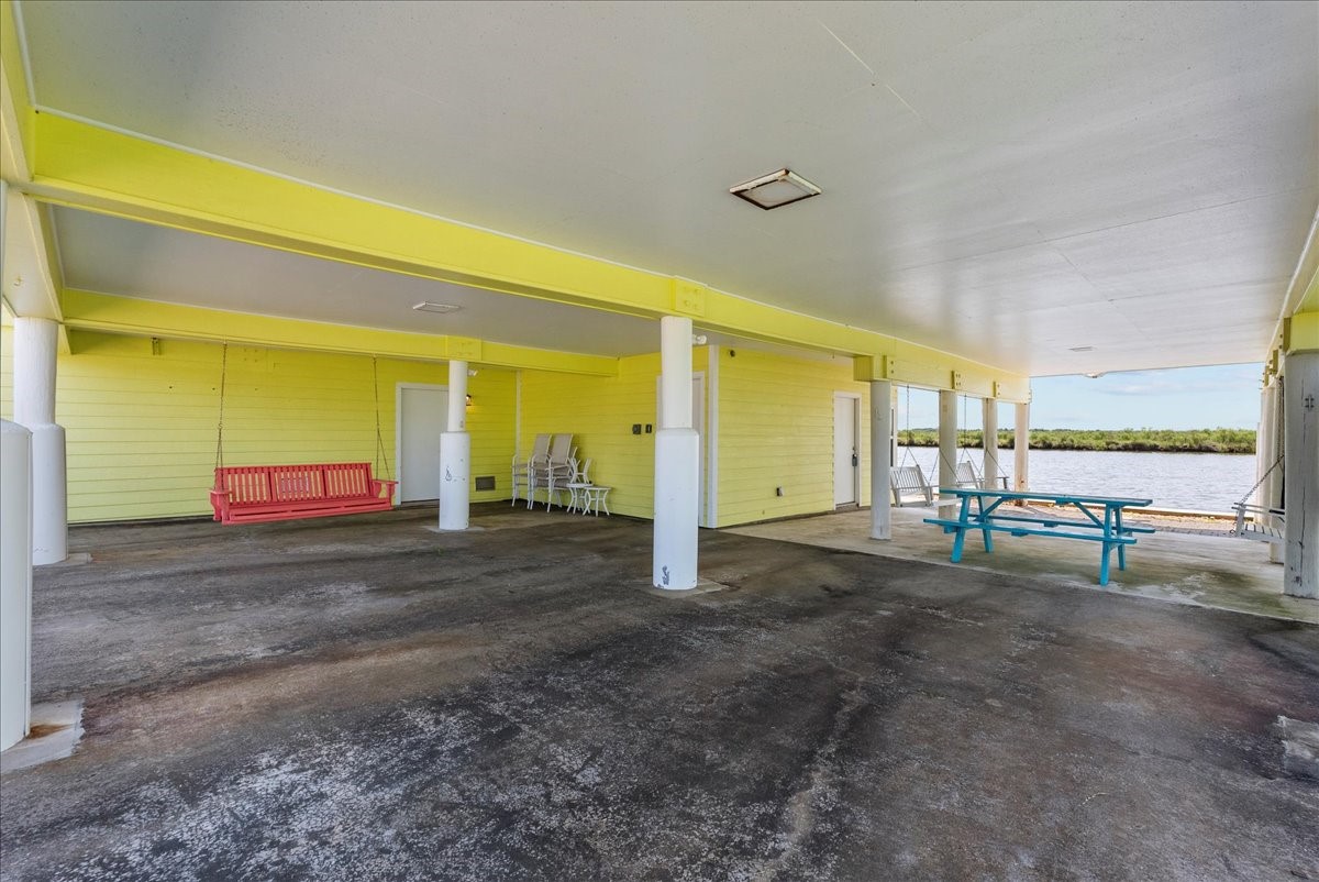 6 Trout Lane Freeport, TX 77541 - Photo 27 of 40 a view of a patio with table and chairs