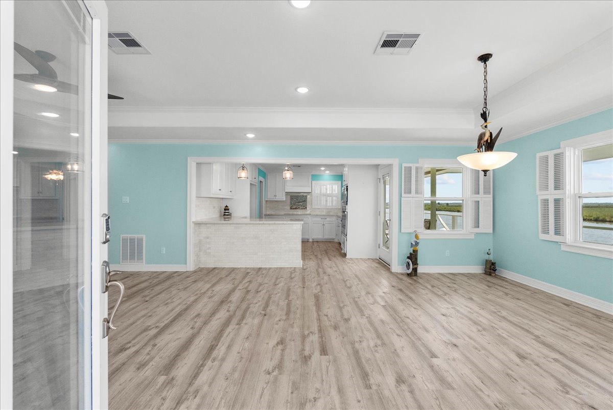 6 Trout Lane Freeport, TX 77541 - Photo 6 of 40 a view of a big room with wooden floor and windows