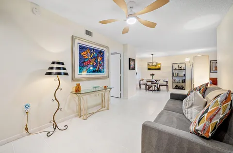 a living room with furniture and white walls