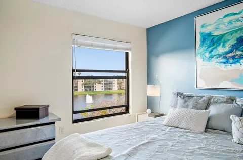 a bedroom with a bed and a fireplace